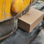 Image showing block of stone being wet sawed