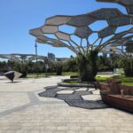 Image of Adelaide Festival Square showing geometric artwork shade structure and tiled flooring surface.