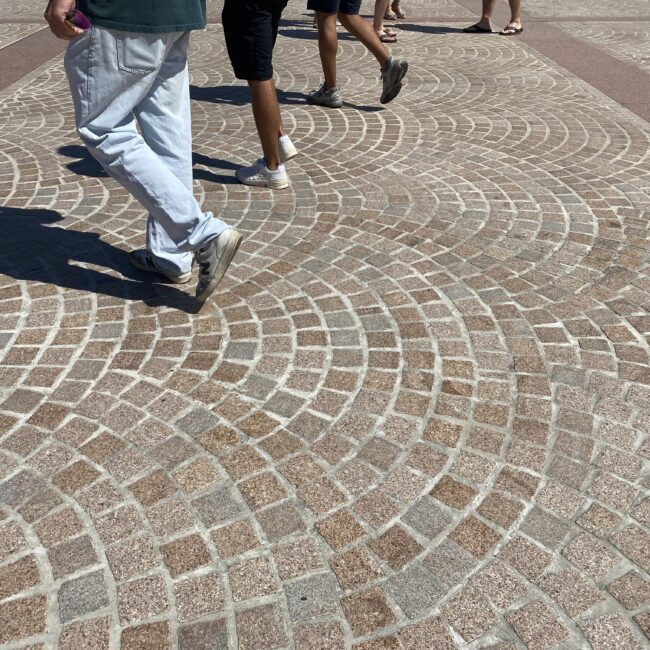 Pedestrians walking across paving at Sydney Opera House
