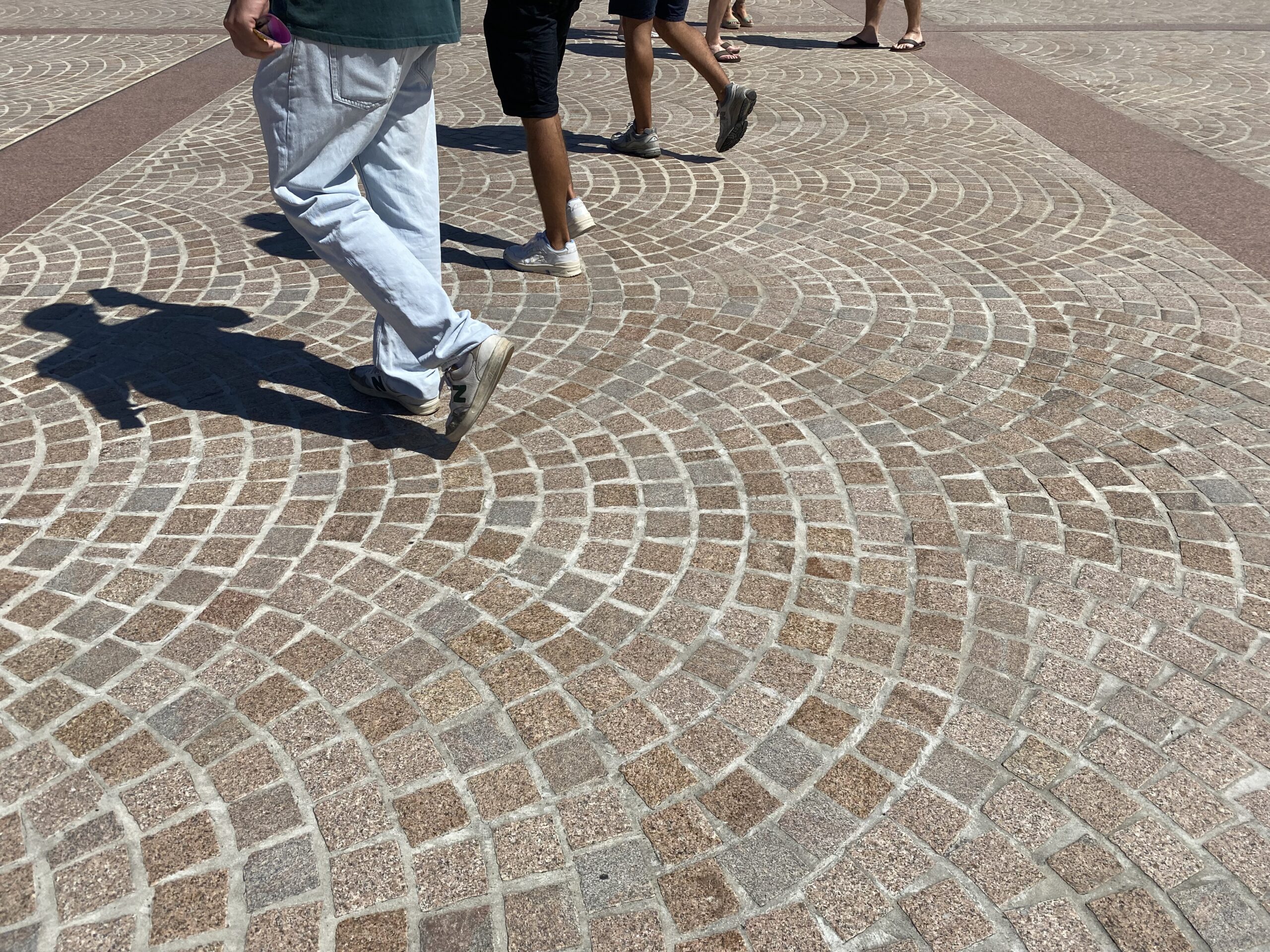 Pedestrians walking across paving at Sydney Opera House